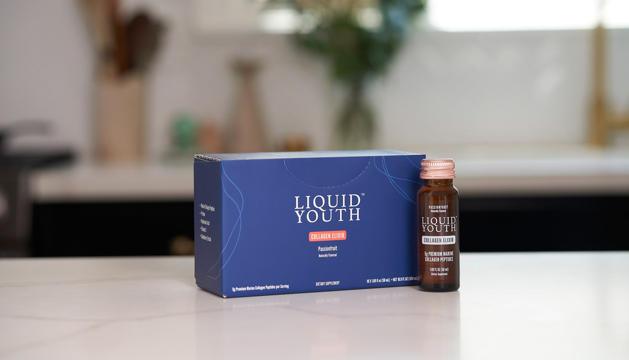 Liquid Youth Collagen Elixir on a kitchen counter for a convenient wellness supplement.