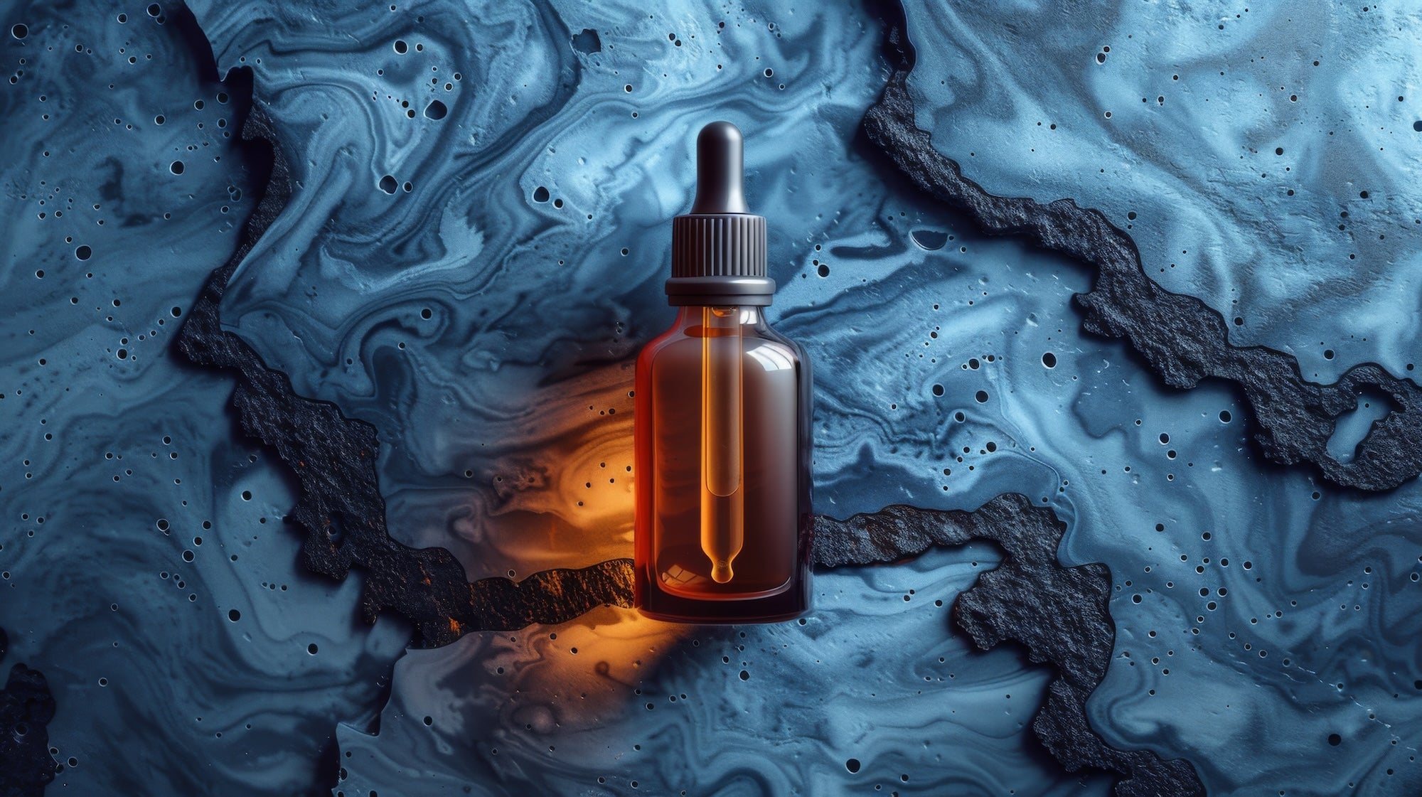 Little amber jar with liquid collagen on a blue marble background